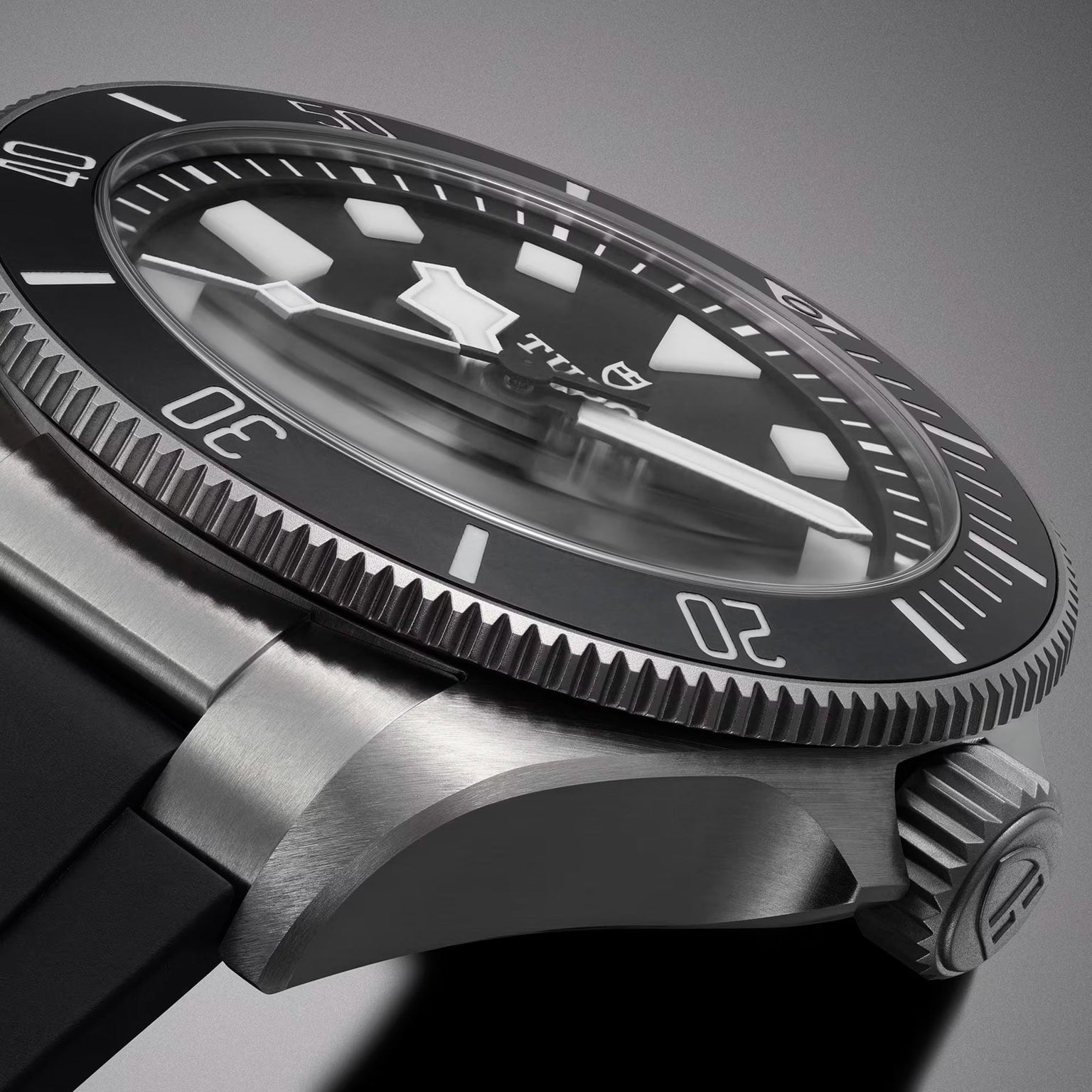 Close-up of the TUDOR Pelagos Ultra, a black and silver diver’s wristwatch featuring a rotating bezel and rubber strap.