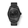 Black diving watch with ceramic bezel, black dial, luminous markers, and matching black metal bracelet.