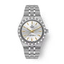 Stainless steel TUDOR Royal watch with silver dial, gold hour markers, and matching metal bracelet.