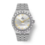 Steel watch with silver dial, gold Roman numerals, gold hands, date window, and textured bezel on linked metal bracelet.