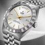 Tudor Royal stainless steel watch with silver dial, gold hour markers and hands, day-date window, and matching bracelet.