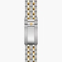 Two-tone stainless steel and gold-plated watch bracelet with shield logo clasp.