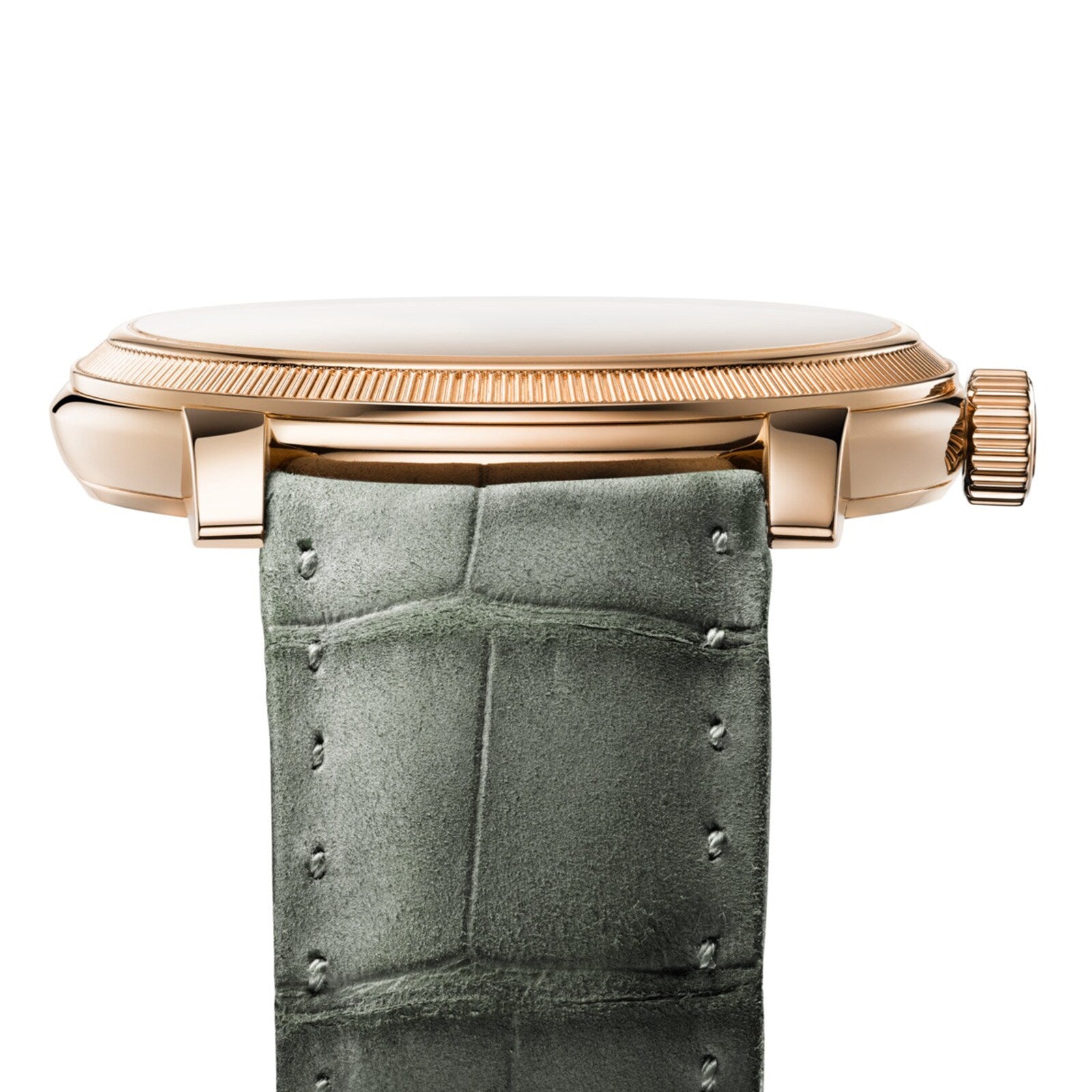 Side view of the Parmigiani Fleurier TORIC Petite Seconde gold wristwatch with a textured green leather strap on a white background.