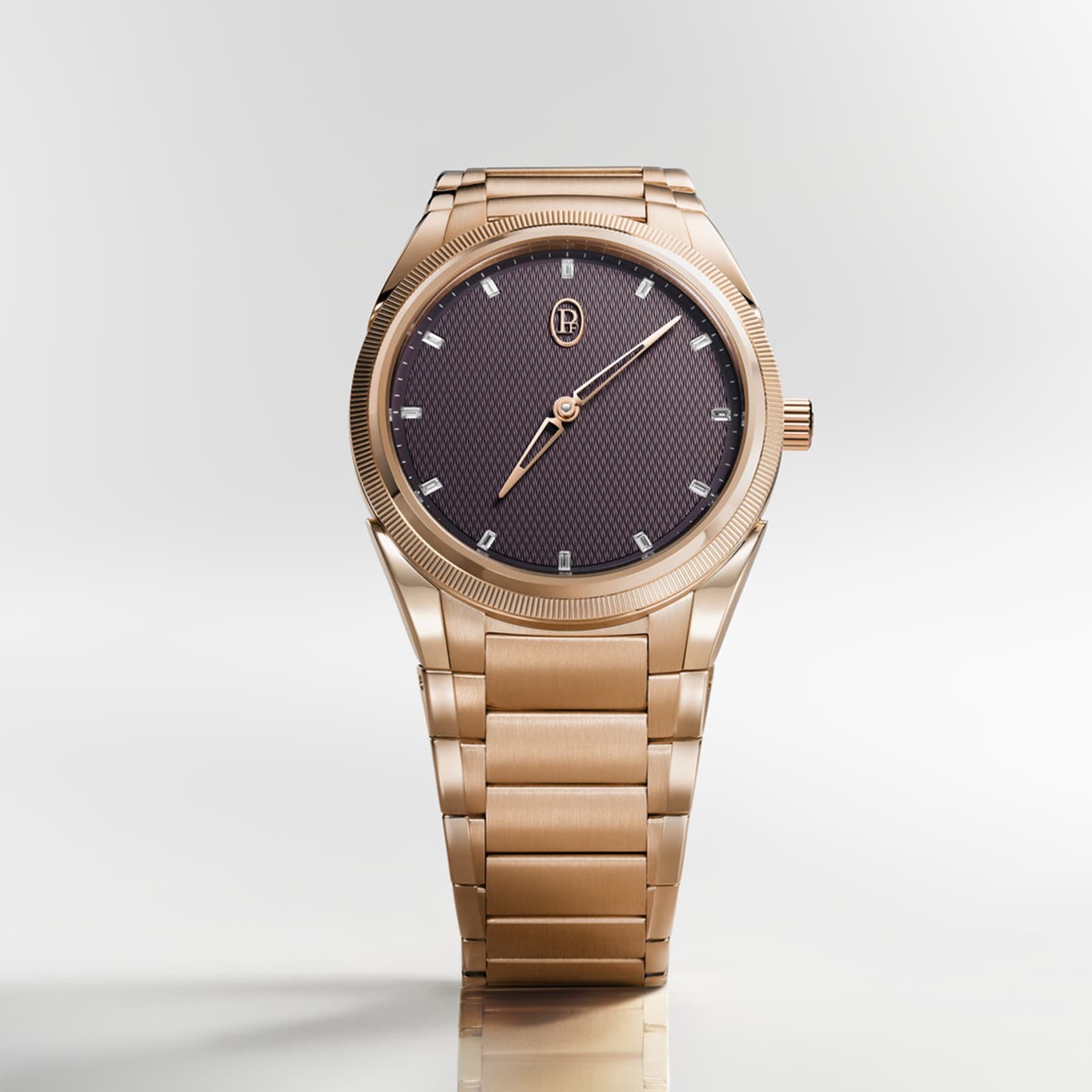 The Parmigiani Fleurier TONDA PF Automatic, featuring a gold case with a textured black dial and gold hour markers, is displayed upright on a plain background.