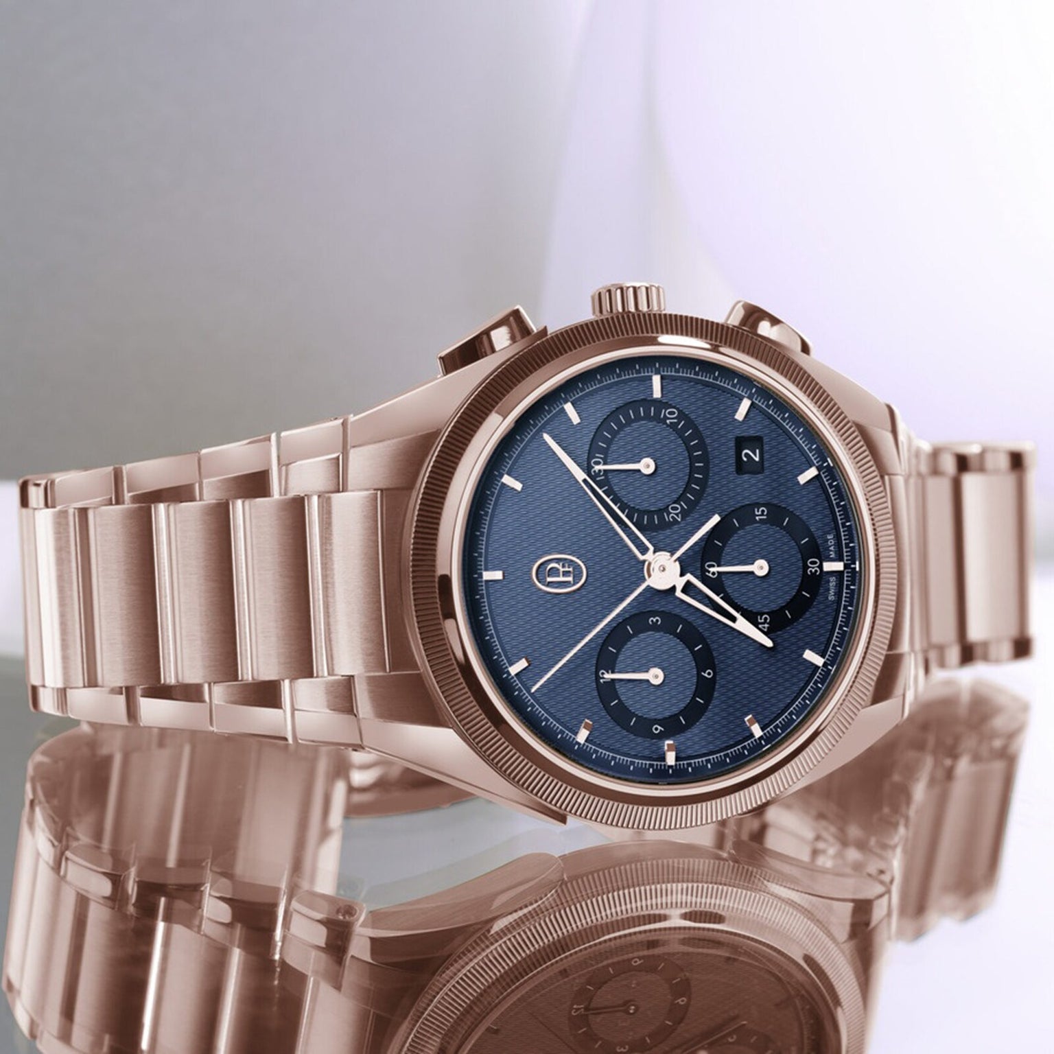 The Parmigiani Fleurier TONDA PF Chronograph, a rose gold wristwatch with a blue chronograph dial, is displayed on a reflective surface.