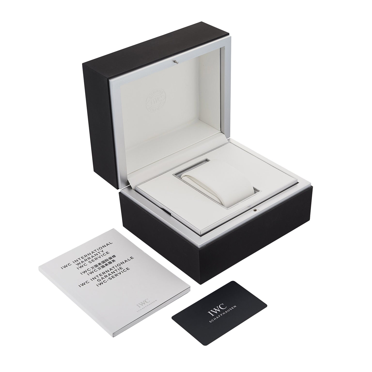 An open IWC Schaffhausen watch box sits beside an instruction booklet and warranty card, ideal for your Portugieser Chronograph, displayed on a white background.