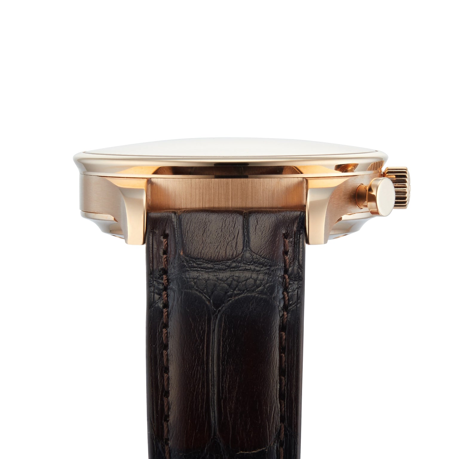 Side view of the IWC Schaffhausen Portugieser Chronograph, showcasing its gold case, polished finish, brown leather strap, and visible crown—a refined example of Swiss watchmaking set against a white background.