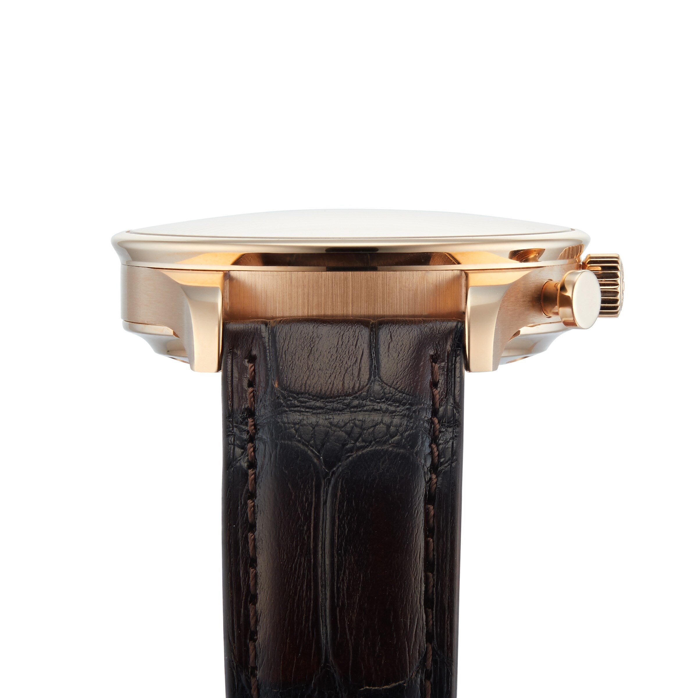 Side view of the IWC Schaffhausen Portugieser Chronograph, showcasing its gold case, polished finish, brown leather strap, and visible crown—a refined example of Swiss watchmaking set against a white background.