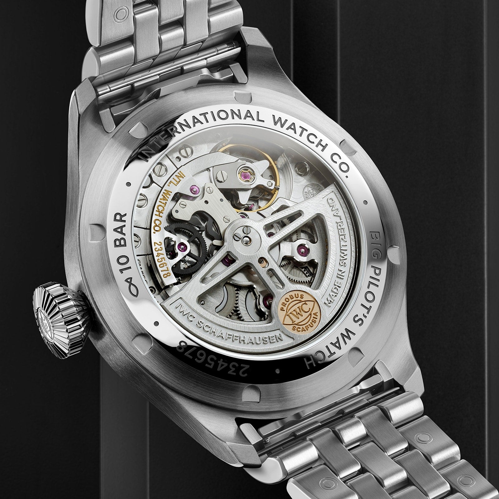 Close-up of the Big Pilots Watch 43 by IWC Schaffhausen, revealing its in-house calibre and detailed engravings through a transparent case back within a sturdy stainless steel case.