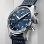The IWC Schaffhausen Pilots Watch Chronograph 41 features a stainless steel case, blue dial with three subdials, day and date display, and a blue leather strap with white stitching.