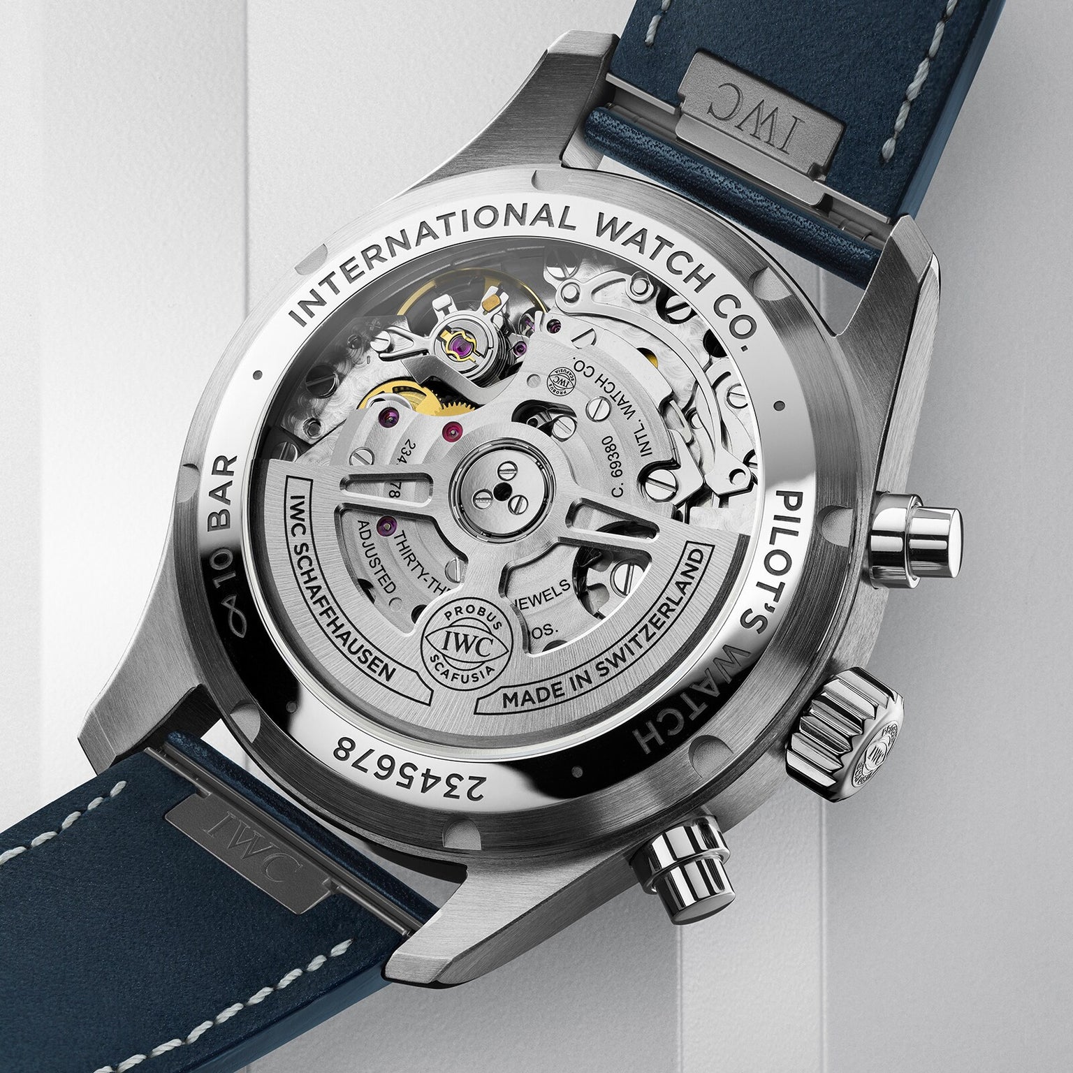 Close-up of the stainless steel case back of the IWC Schaffhausen Pilots Watch Chronograph 41, revealing its detailed mechanical movement and engraved markings.