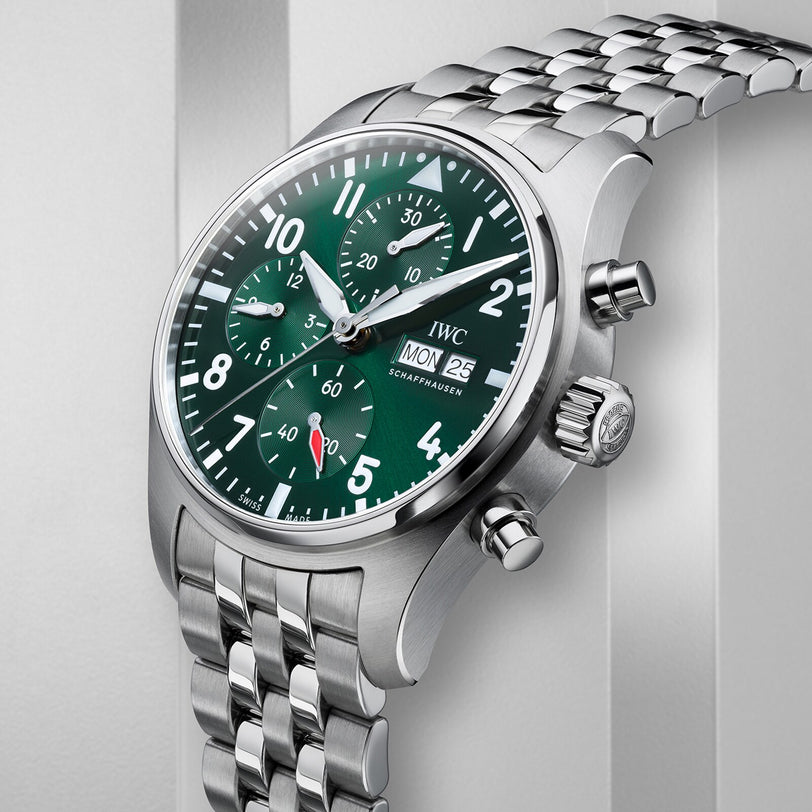 The IWC Schaffhausen Pilots Watch Chronograph 41 features a stainless steel case, racing green dial, three subdials, date and weekday display, and is paired with a silver metal bracelet.