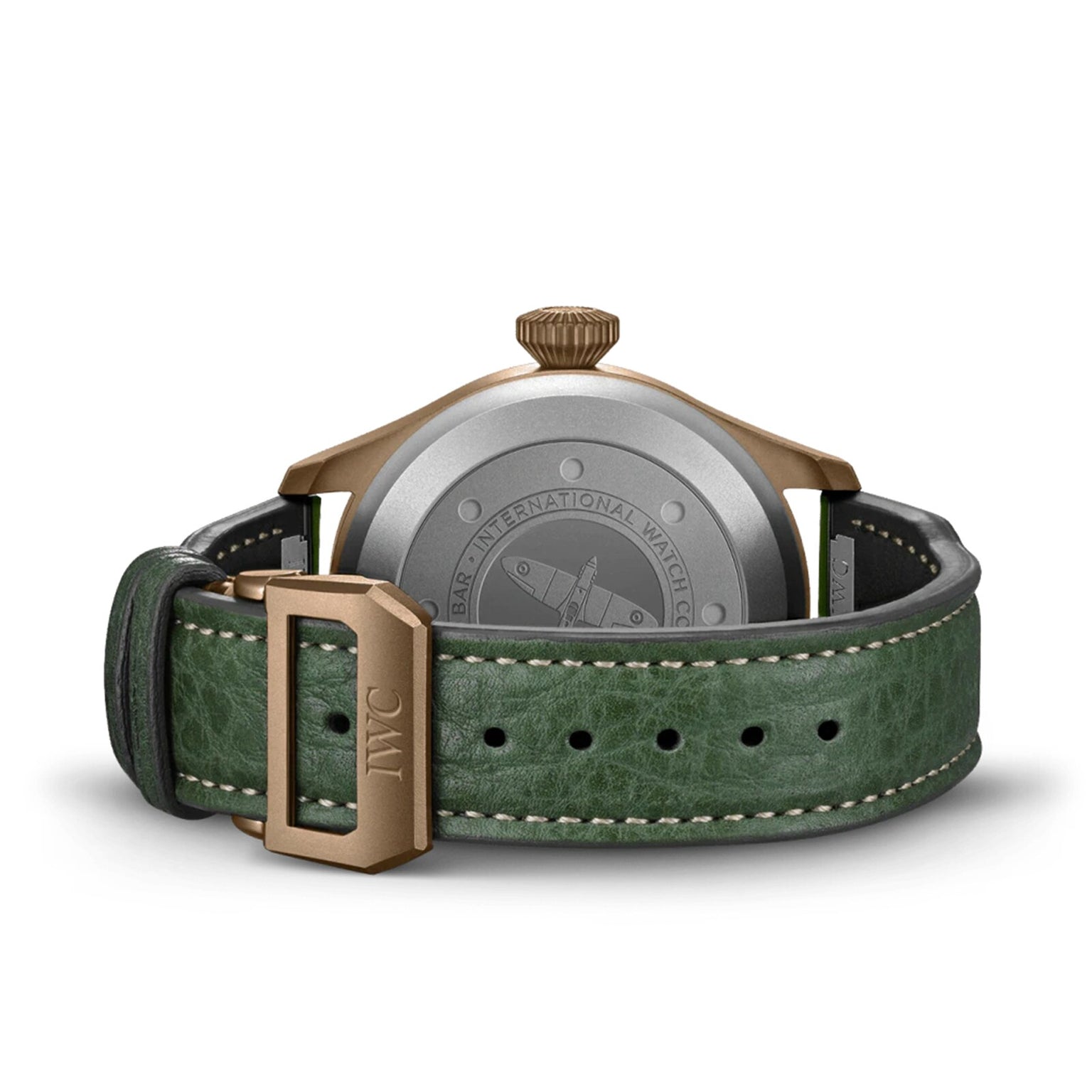 The IWC Schaffhausen Big Pilots Watch 43 Spitfire is shown from the back with a green leather strap, bronze buckle, engraved airplane motif, INTERNATIONAL WATCH CO. text, and EasX-CHANGE system compatibility.