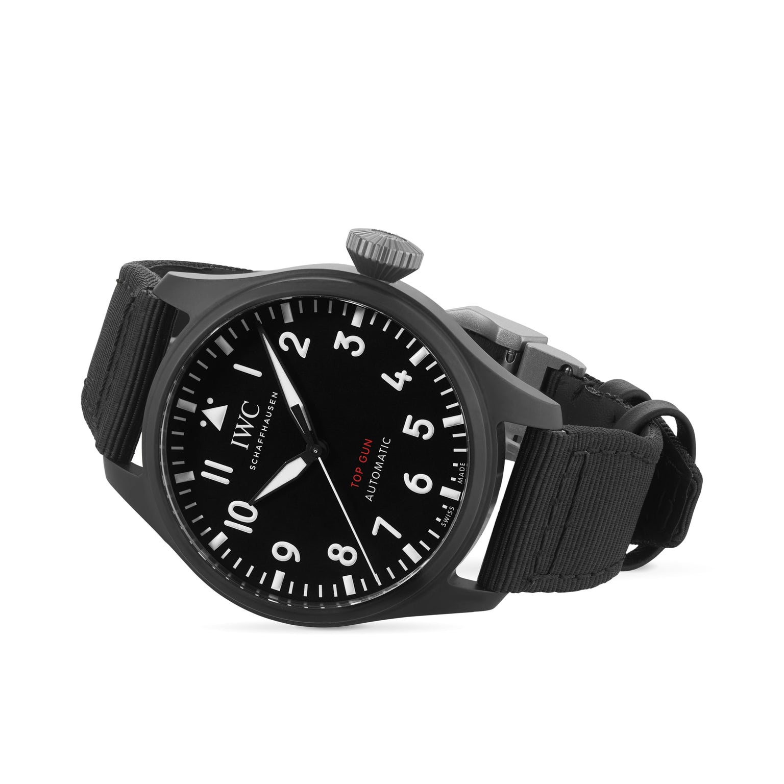 The IWC Schaffhausen Big Pilots Watch 43 Top Gun, featuring a black zirconium oxide ceramic case, round dial with white Arabic numerals, date display, and black fabric strap, is shown angled on a white background.