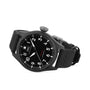 The IWC Schaffhausen Big Pilots Watch 43 Top Gun, featuring a black zirconium oxide ceramic case, round dial with white Arabic numerals, date display, and black fabric strap, is shown angled on a white background.