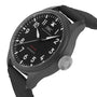 The IWC Schaffhausen Big Pilots Watch 43 Top Gun features a black zirconium oxide ceramic case, black fabric strap, white numerals, and a prominent textured crown, with Top Gun Automatic on the dial.