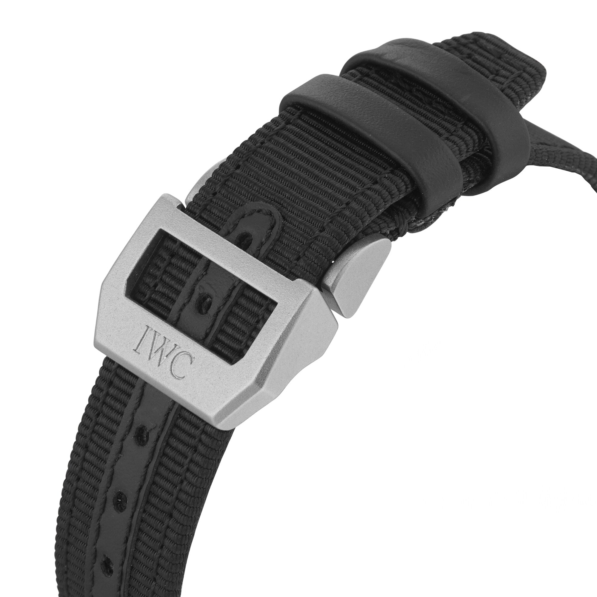 Close-up of a black fabric watch strap with a silver buckle engraved with IWC Schaffhausen and two black loops, designed for the Big Pilots Watch 43 Top Gun.