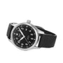 The IWC Schaffhausen Pilot’s Watch Mark XX, with a stainless steel case, black dial with white numerals, black leather strap, and date display, is displayed at an angle against a white background.