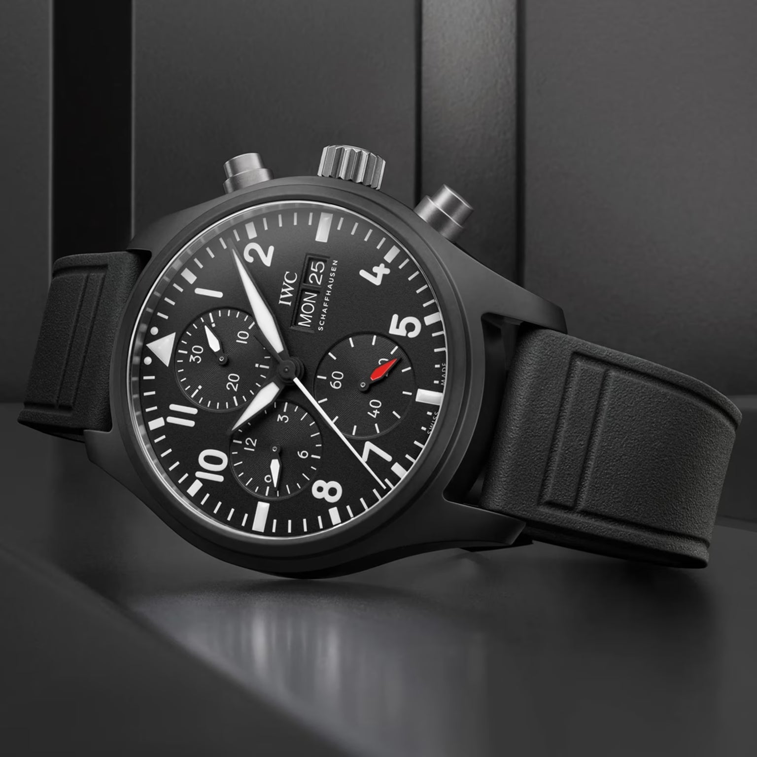 Black wristwatch with detailed face on a dark background