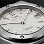 Close-up of the IWC Schaffhausen Ingenieur Automatic 35, featuring a textured white dial, silver markers and hands, plus a date window at 3 o’clock—an iconic timepiece inspired by Gérald Genta.