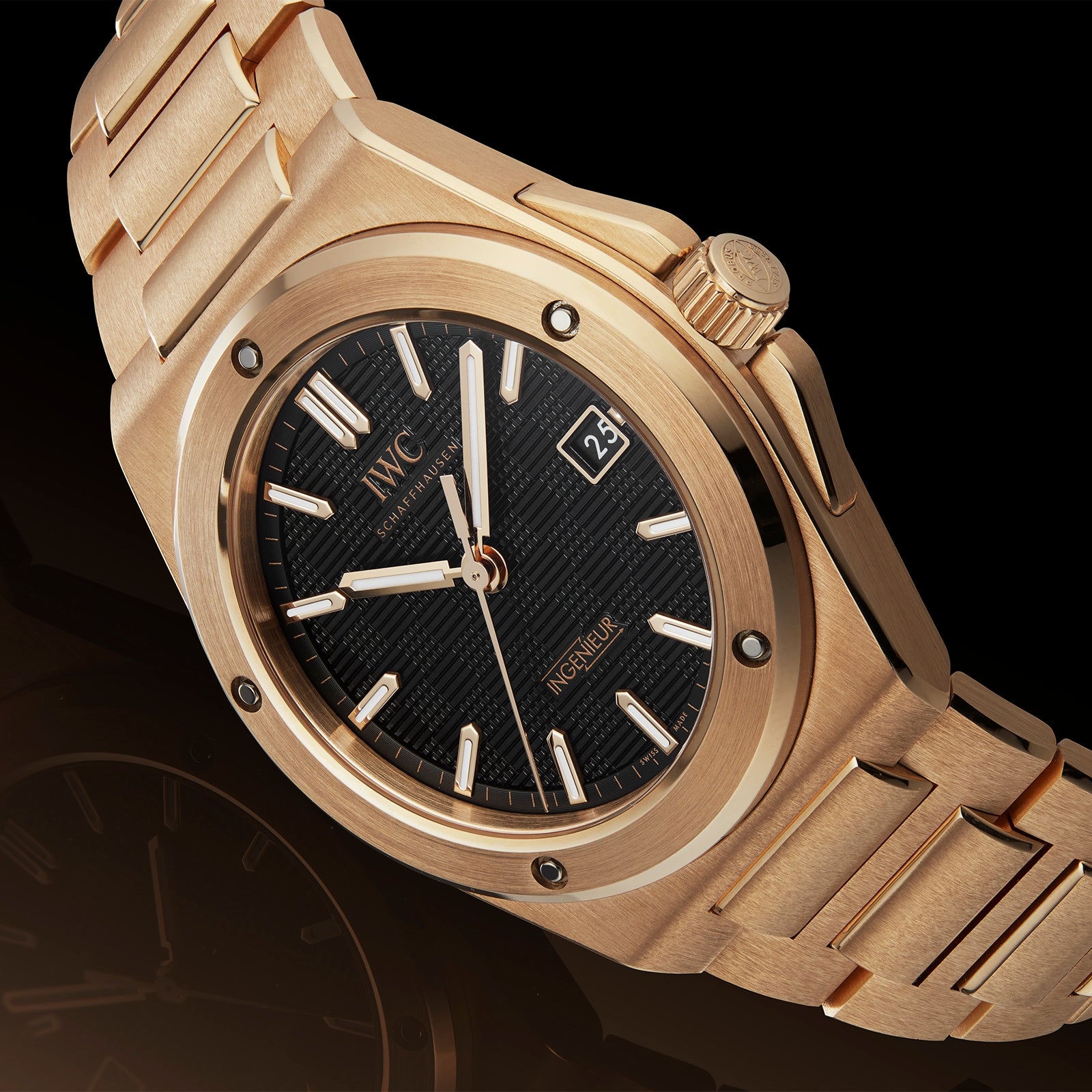 The IWC Schaffhausen Ingenieur Automatic 40 boasts an 18-carat gold case, black textured dial, luminescent hands and markers, plus a date window at 3 oclock on a sleek black background.