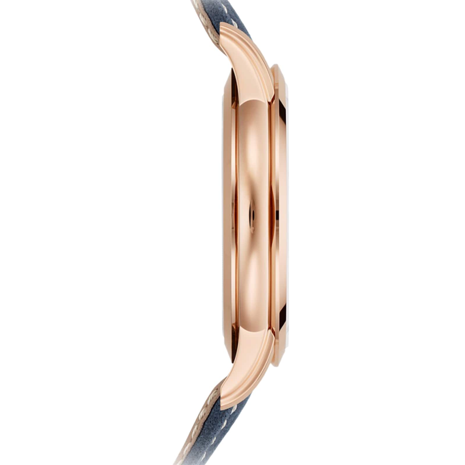 Side view of the Patek Philippe Complications 5224R-001, a slim rose gold wristwatch with a dark leather strap, set against a white background.
