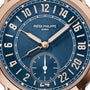 Close-up of the Patek Philippe Complications 5224R-001 watch face with gold hands and numerals, displaying the time 8:20.