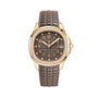 The Patek Philippe Aquanaut 5268/200R-010 features a diamond bezel, a brown patterned dial, and a matching textured brown strap.