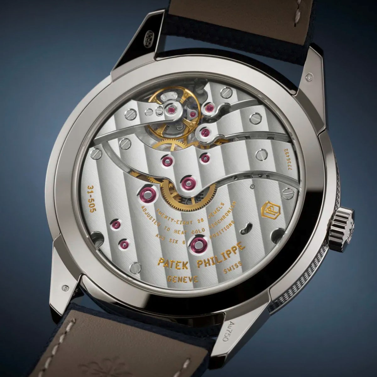 Close-up of the Patek Philippe Complications 5328G-001 watch back, highlighting its intricate mechanical movement and engraved details.