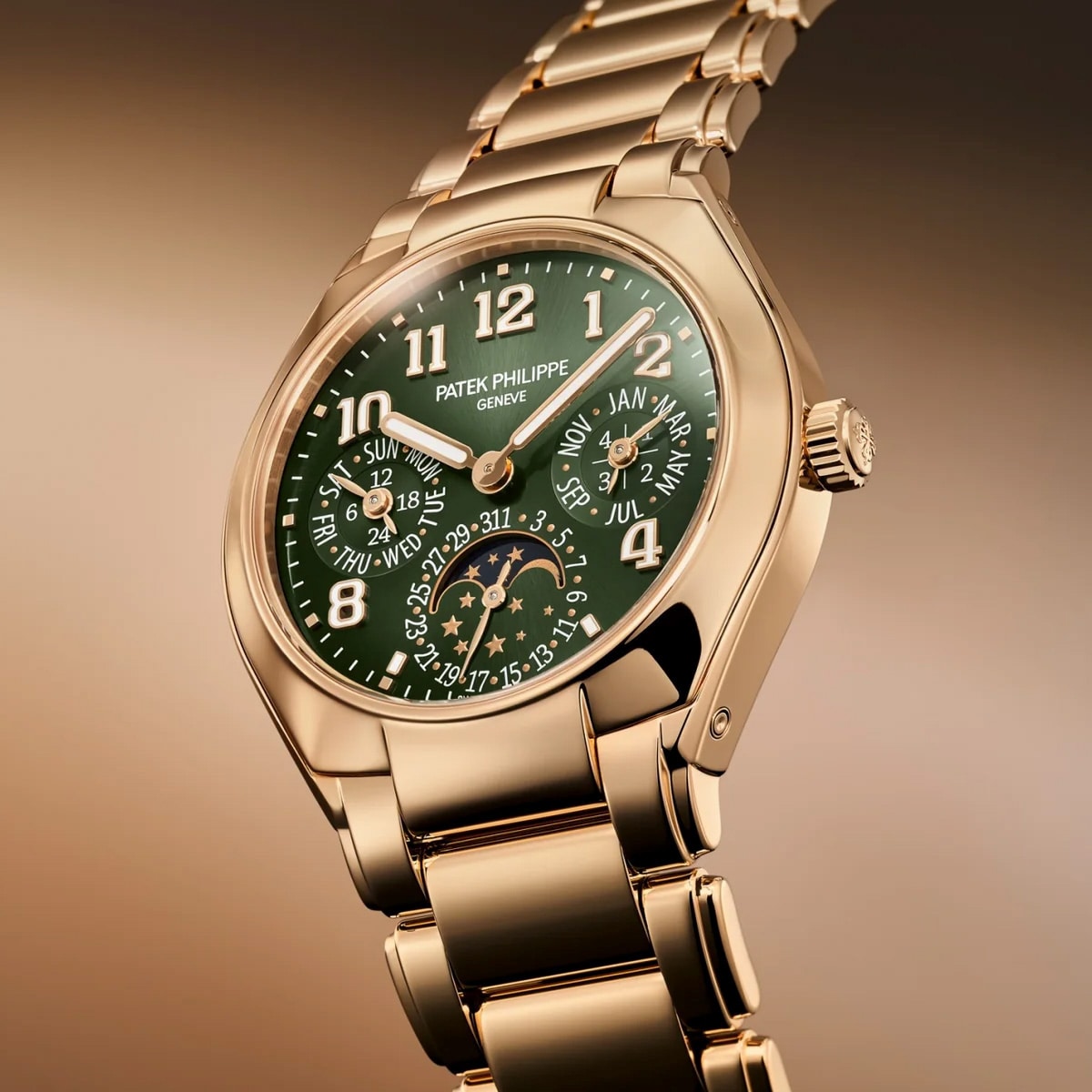Patek Philippe Twenty~4 7340/1R-010: gold wristwatch featuring a green dial, date subdials, moon phase display, and gold bracelet.