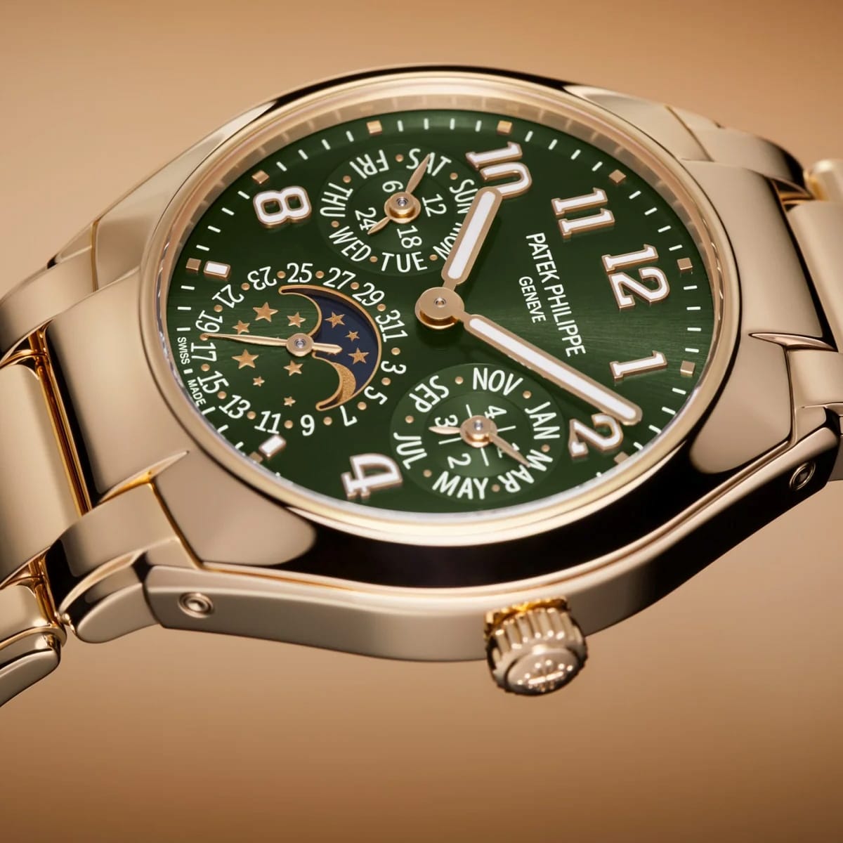 The Patek Philippe Twenty~4 7340/1R-010 is a gold wristwatch featuring a green dial, moon phase, calendar functions, and bold white numerals on a gold band.