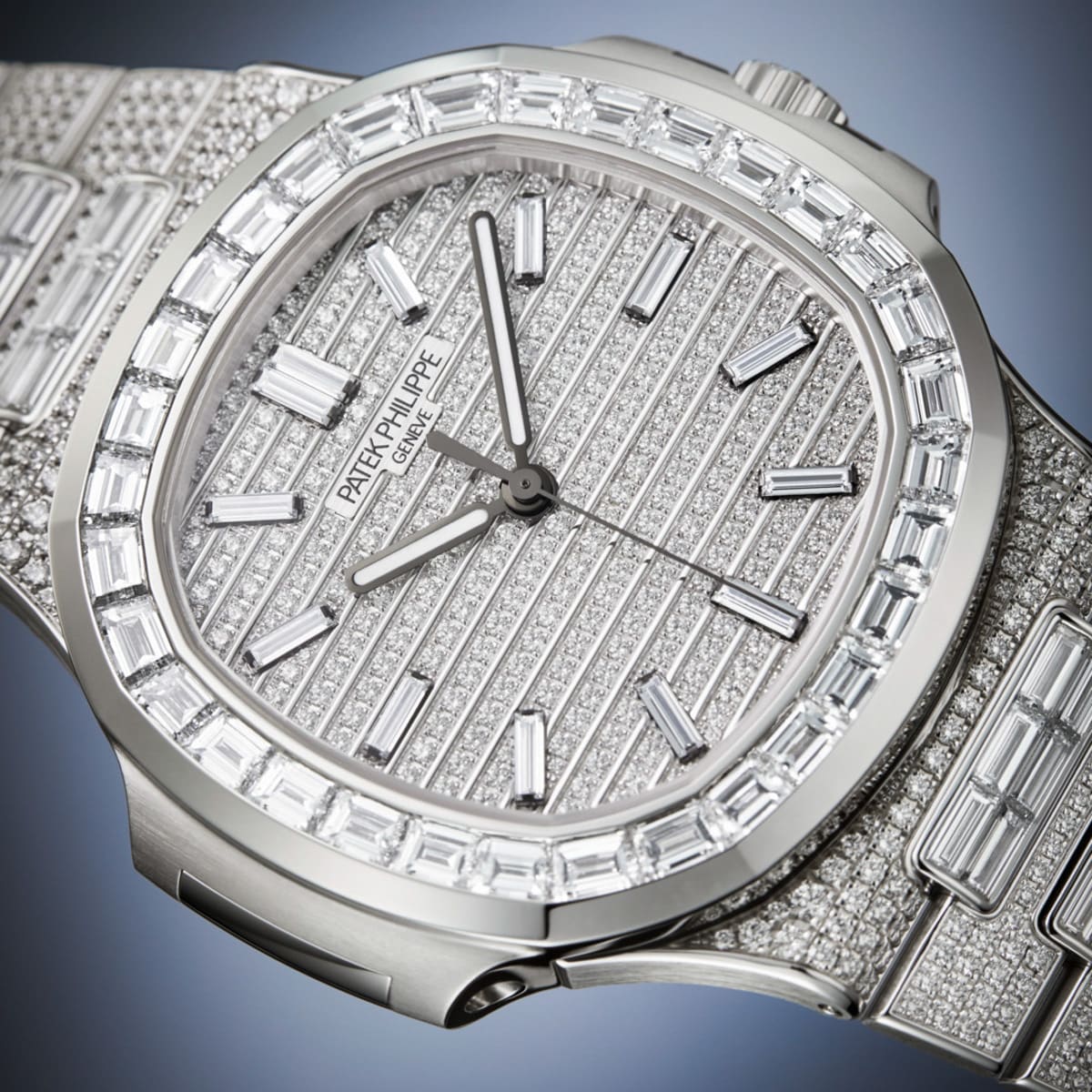 Close-up of a Patek Philippe Nautilus 5811/1460G-001, a luxury watch featuring a diamond-encrusted design, silver face, and metal band.
