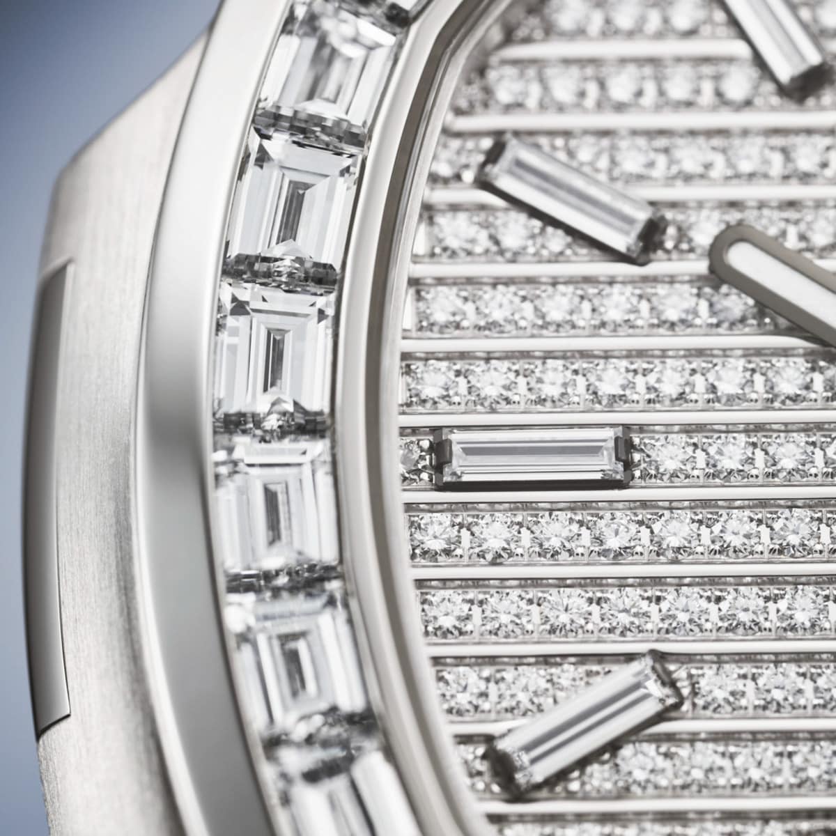 Close-up of the Patek Philippe Nautilus 5811/1460G-001 watch face, adorned with rows of round and baguette-cut diamonds.