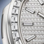 Close-up of the Patek Philippe Nautilus 5811/1460G-001 watch face, adorned with rows of round and baguette-cut diamonds.