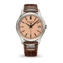 Patek Philippe watch with brown leather strap on a white background