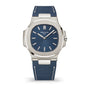 Patek Philippe watch with blue strap and face on a white background