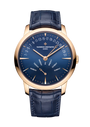 Rose gold watch with blue dial, day-date retrograde display, rose gold hands, and navy crocodile leather strap.