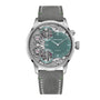 The Armin Strom Mirrored Force Resonance Manufacture Edition Green features a silver case, green dial with visible gears, and a grey leather strap.
