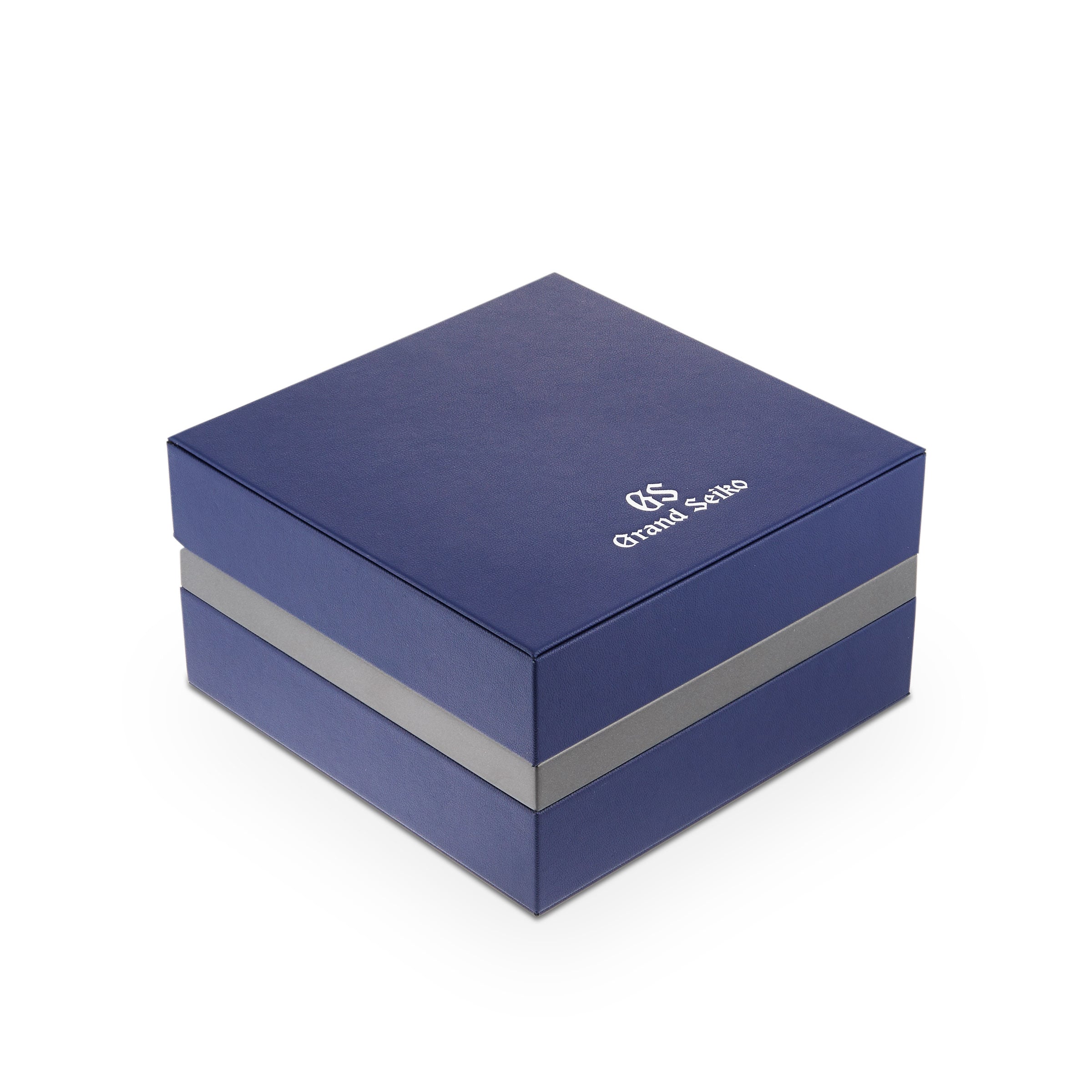 A square, dark blue Grand Seiko gift box with a silver stripe and the logo on the lid—ideal for presenting the Grand Seiko Spring Drive Heritage timepiece.