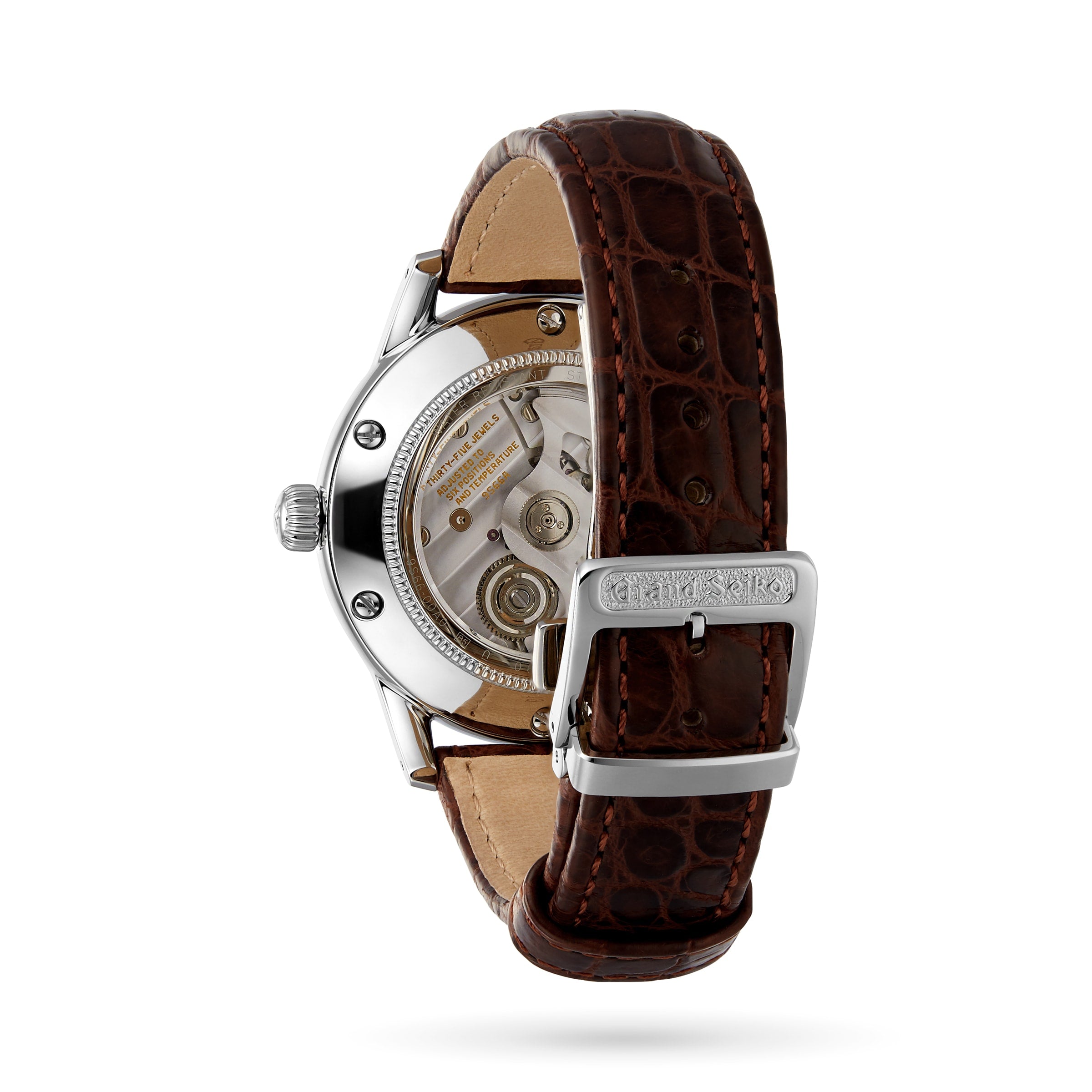 A Grand Seiko Automatic GMT Elegance wristwatch with a visible automatic movement, stainless steel case, and brown leather strap is shown from the back.