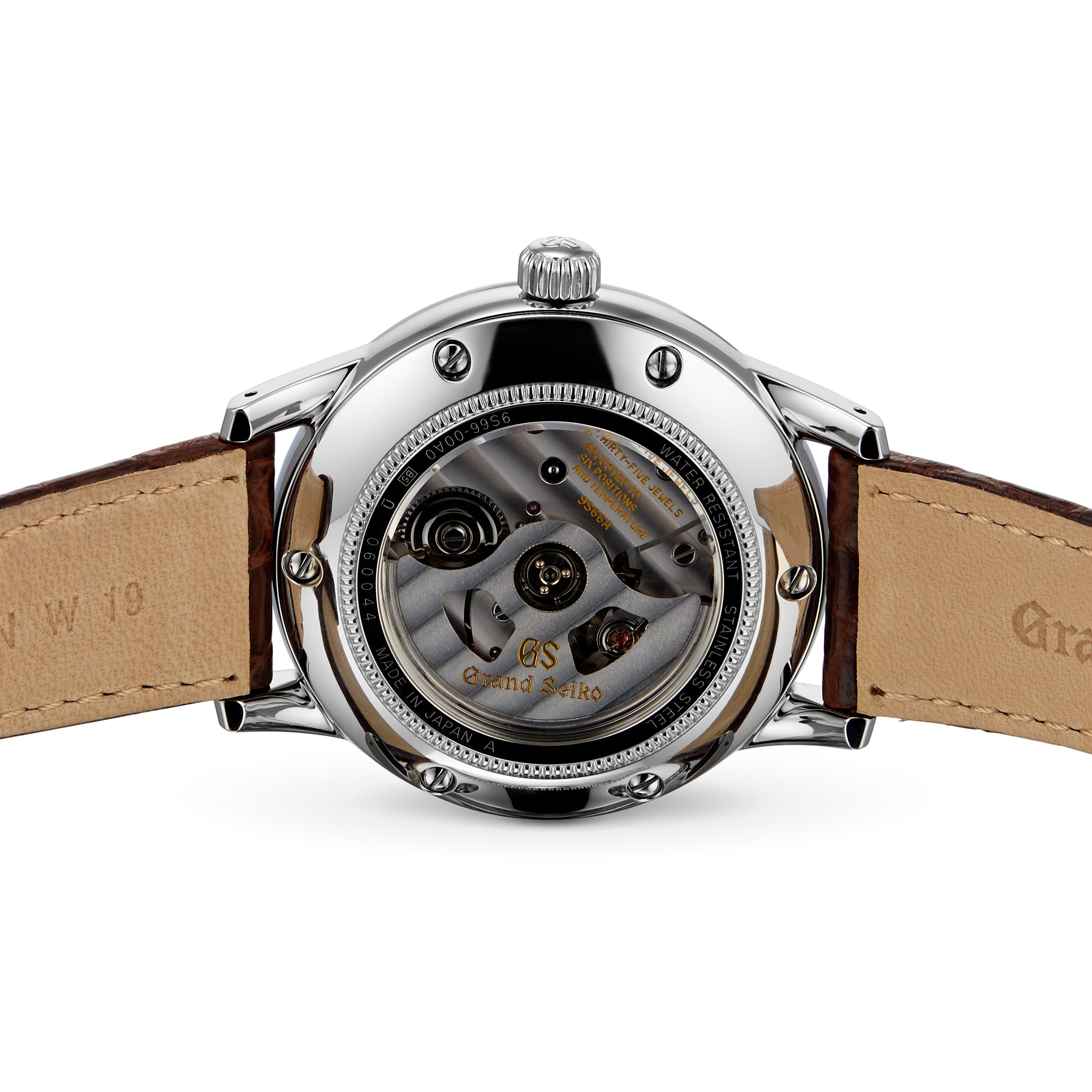 The back view of the Grand Seiko Automatic GMT Elegance reveals its automatic movement through a transparent case back, complemented by brown leather straps.