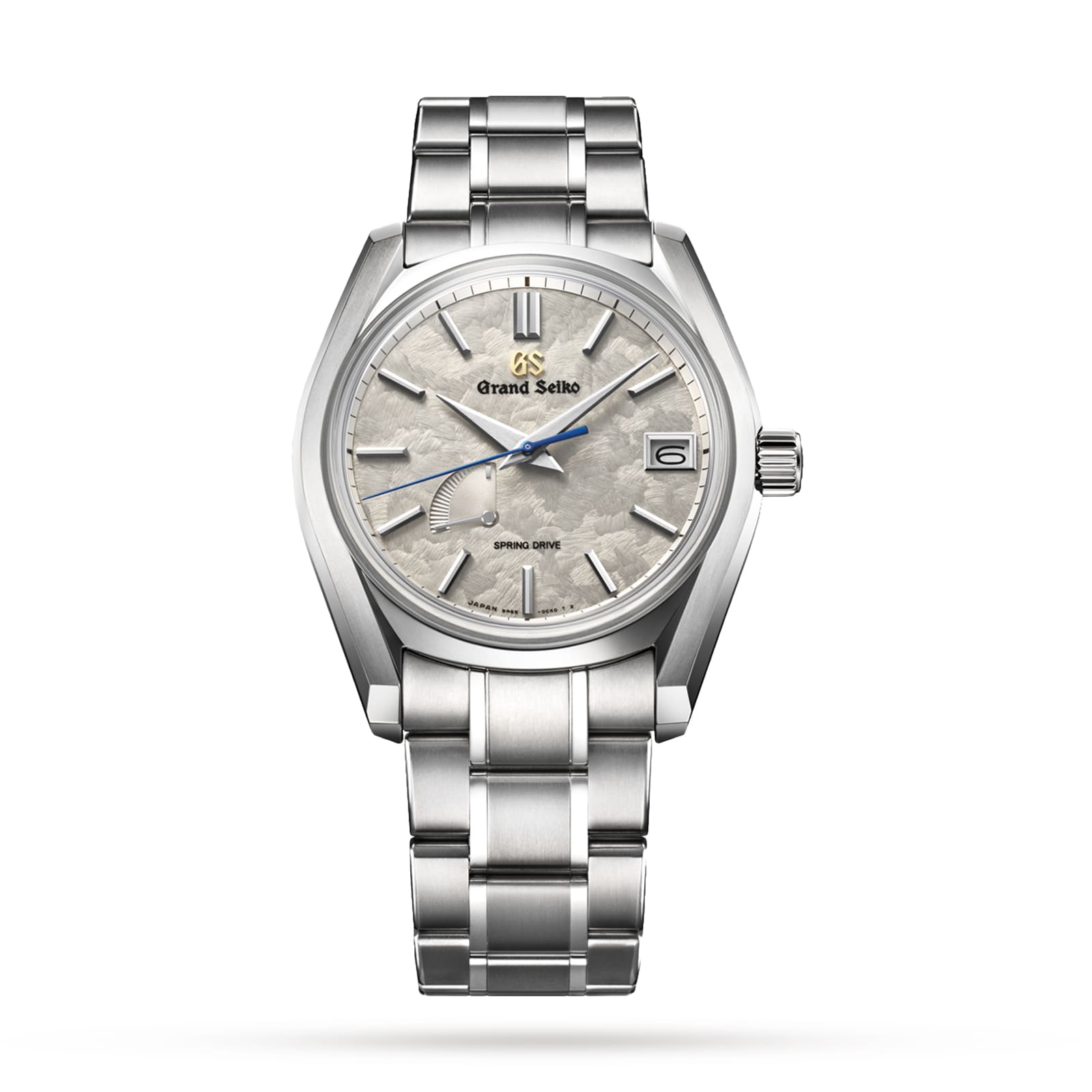 The Grand Seiko Spring Drive Heritage wristwatch features a textured white dial, date display at 3 o’clock, and stainless steel bracelet, all powered by the precise Spring Drive movement.