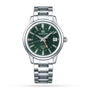 The Grand Seiko Hi-Beat GMT Elegance wristwatch features a green spring equinox-inspired dial, silver hour markers, date at 3 oclock, Calibre 9S86 movement, and metal link bracelet, shown against a white background.