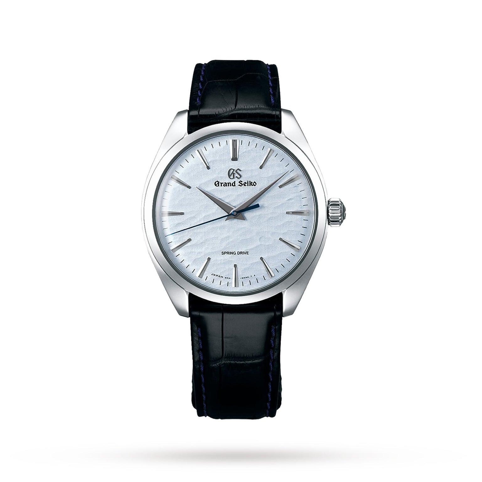The Grand Seiko Spring Drive Elegance features a silver textured Lake Suwa-inspired dial, silver markers and hands, black leather strap, and stainless steel case, shown on a white background. Powered by Grand Seikos innovative Spring Drive movement.
