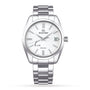 The Grand Seiko Spring Drive Heritage is a stainless steel wristwatch with a white textured dial, silver markers, date at 3 o’clock, metal link bracelet, and features the precise Spring Drive movement.
