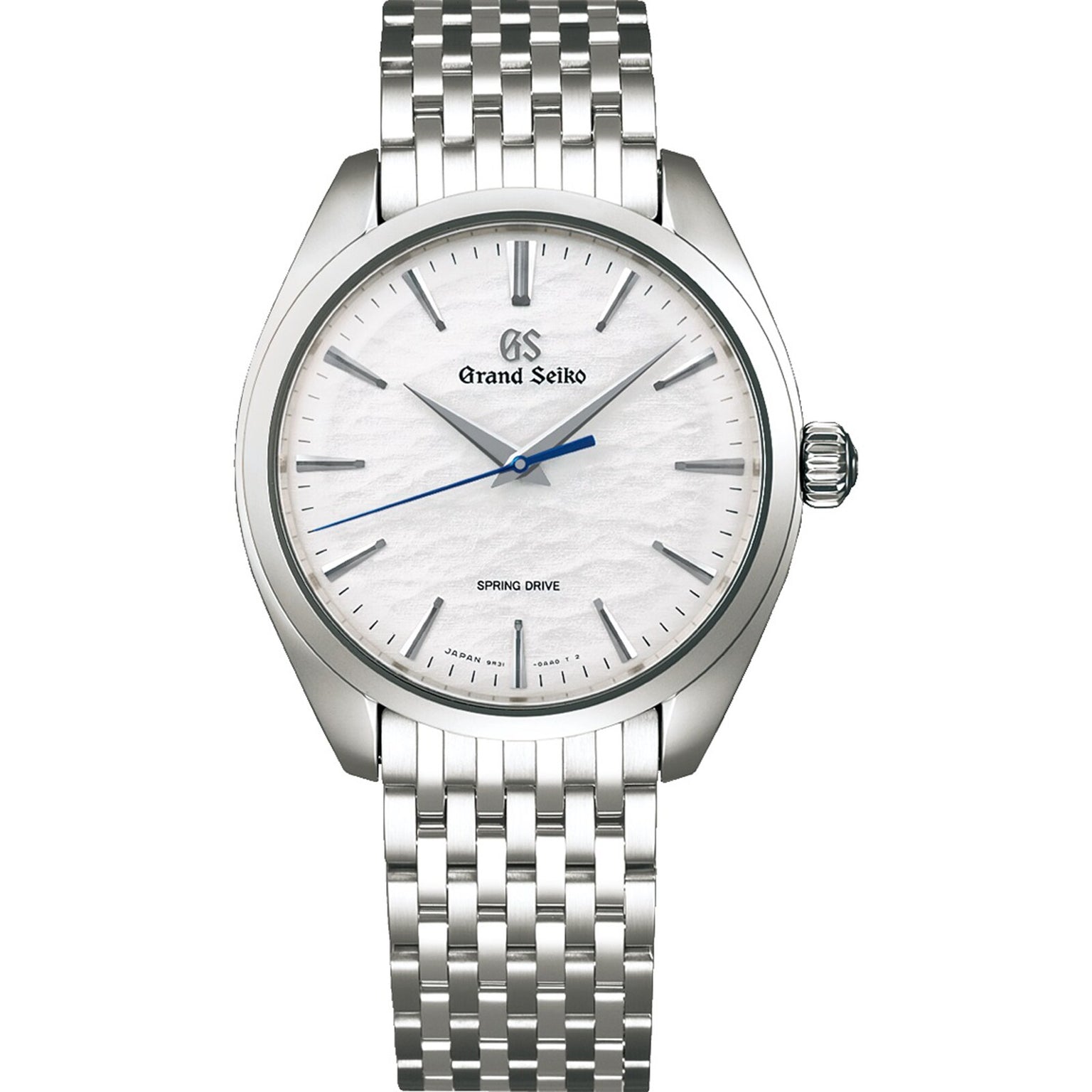 The Grand Seiko Spring Drive Manual Elegance features a textured white dial, blue second hand, and metal bracelet, inspired by Lake Suwa, displaying the time as 7:08:38.