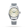 The Grand Seiko Spring Drive Heritage, a stainless steel wristwatch with cream dial, date at 3 o’clock, and silver markers and hands in the 44GS Contemporary Design, is shown against a plain white background.