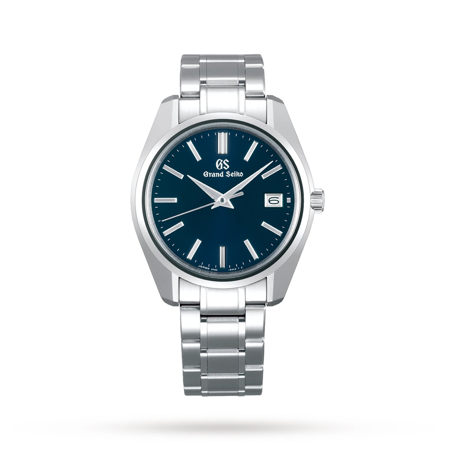 The Grand Seiko Quartz Heritage is a silver stainless steel wristwatch featuring a blue dial, Zaratsu-polished surfaces, silver hour markers, and a date display at 3 o’clock.