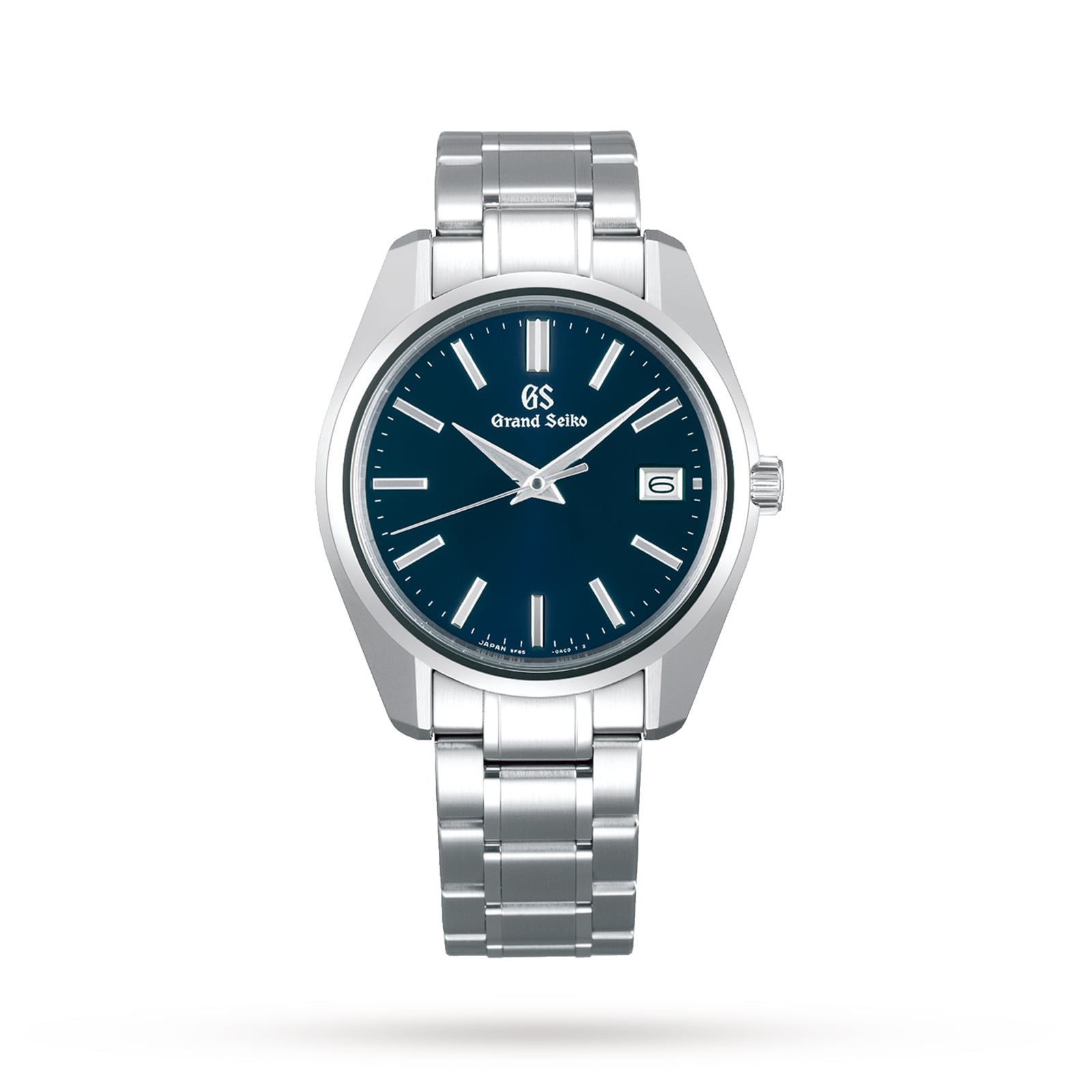 The Grand Seiko Quartz Heritage is a silver stainless steel wristwatch featuring a blue dial, Zaratsu-polished surfaces, silver hour markers, and a date display at 3 o’clock.