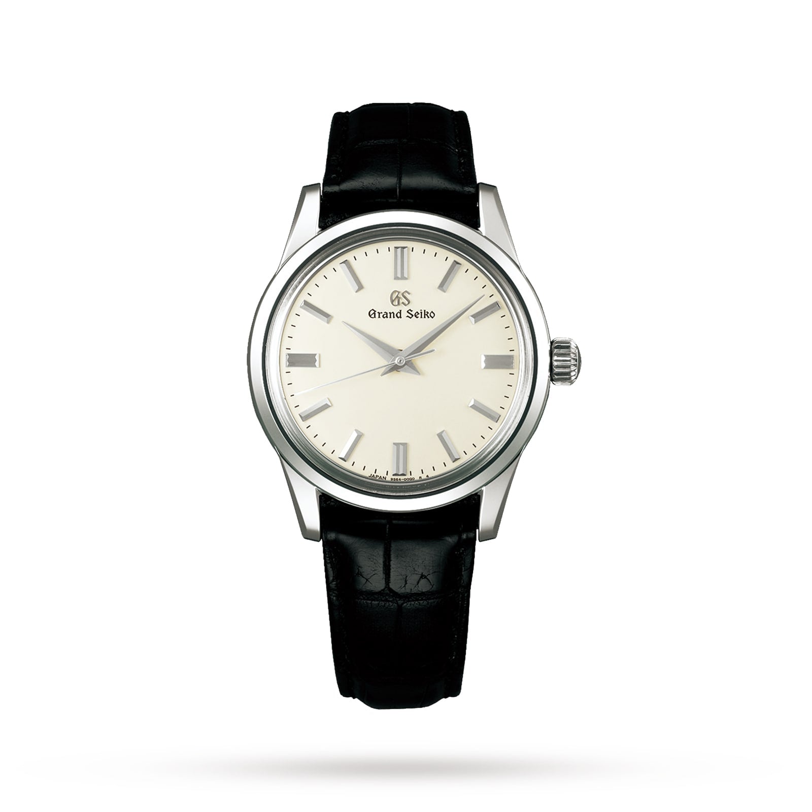 The Grand Seiko Manual Elegance wristwatch features a silver dial, silver markers, and a black leather strap, with an exhibition case back displaying its advanced hairspring technology, shown on a white background.